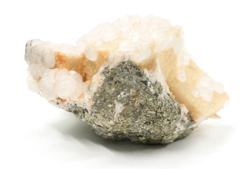 Back side of calcite on dolomite with a matrix consisting of, among other minerals, pyrite and sphalerite from the Trepča Mine in Kosovo.